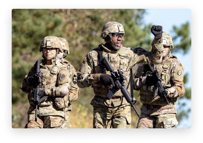 soldiers with guns in hand and currently engaged in training